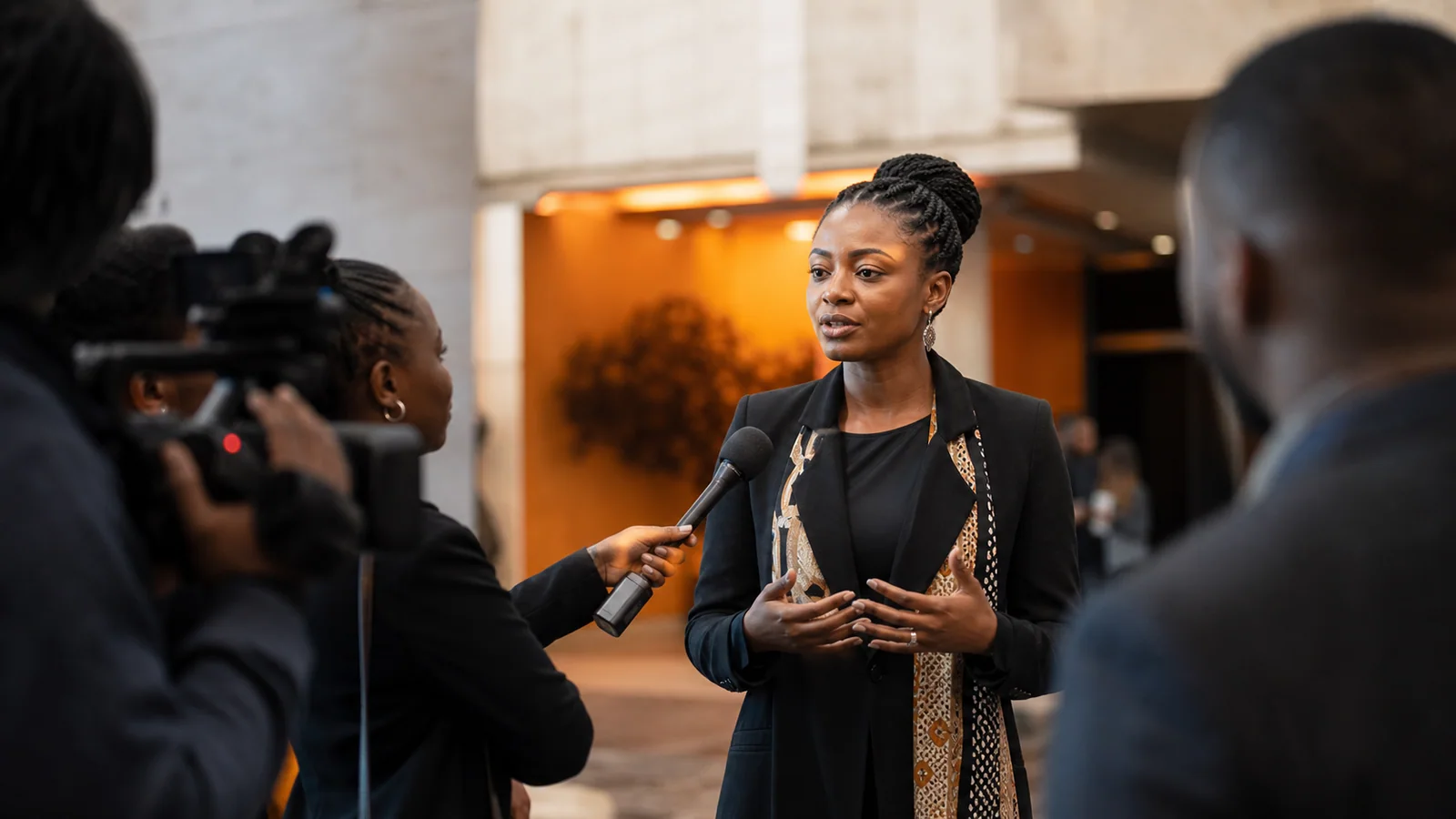 South African executive speaking with journalists during a media interview